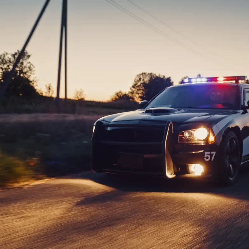 A police car in pursuit of a driver on a highway