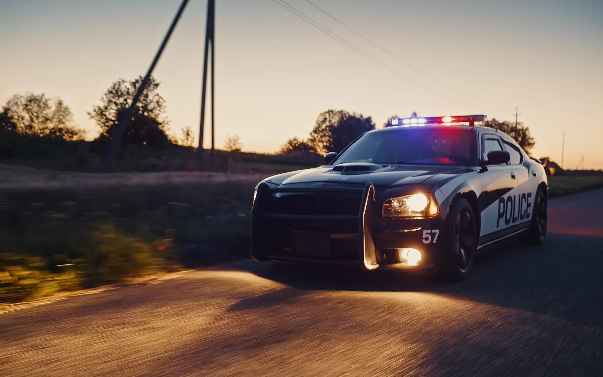 A police car in pursuit of a driver on a highway