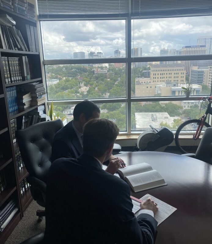 GHC Lawyers sitting in a meeting room.